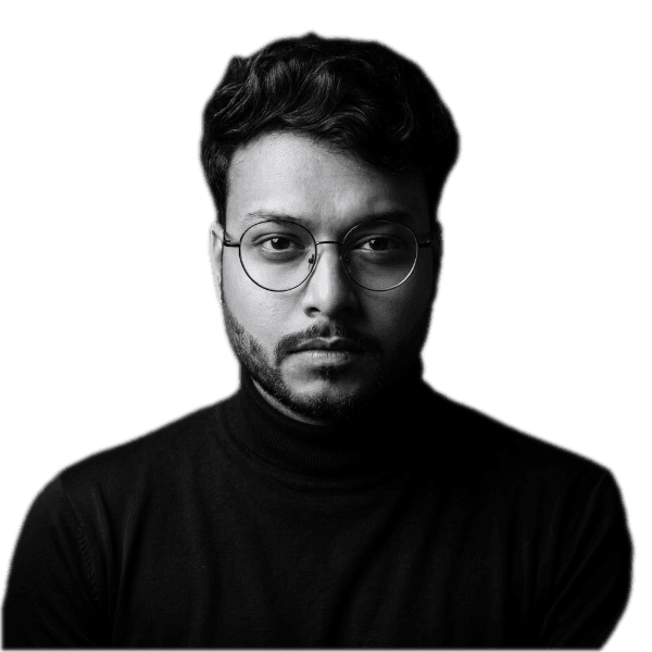 Sourav Dey in a black turtleneck and round glasses, looking straight into the camera